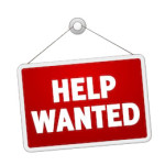 "Help Wanted" sign white writing on red sign background