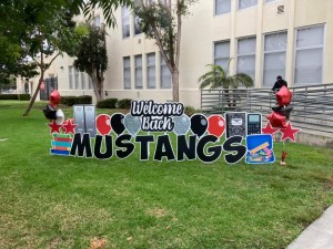 Welcome Back Mustangs First Day of School sign on Front Lawn Rogers Middle School
